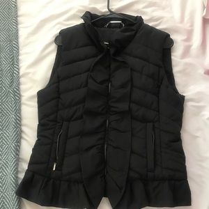 Black ruffle puffer vest